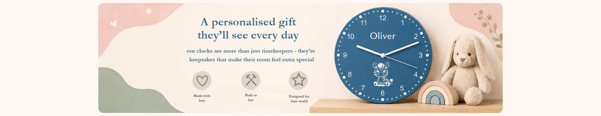 Personalised blue children’s clock displayed beside a soft toy bunny